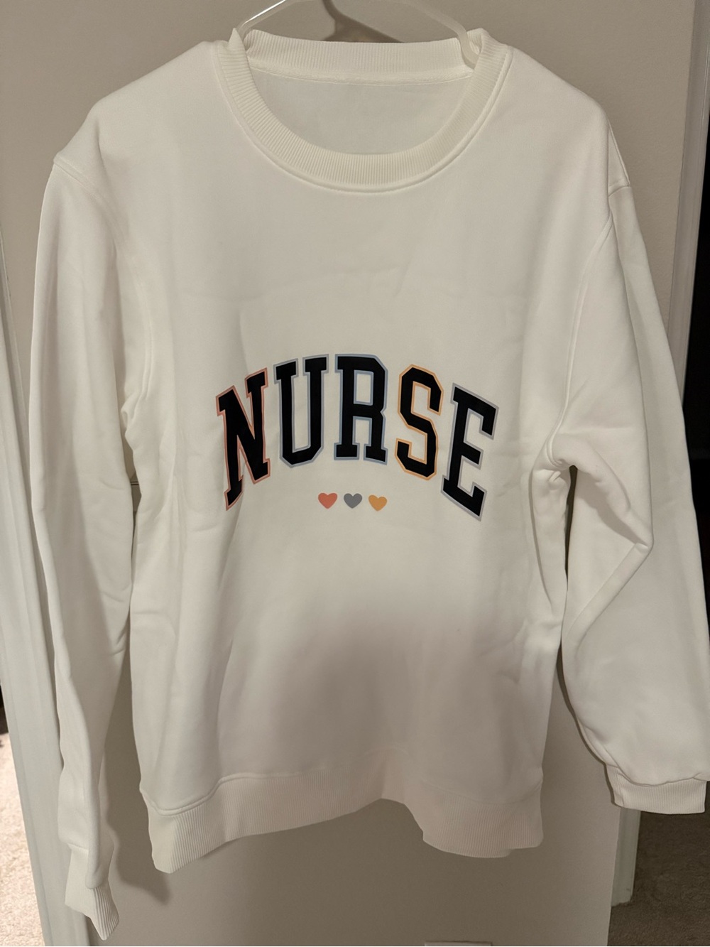 NURSE White Graphic Sweatshirt with Heart Accents